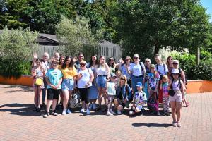 Ukrainian Children & Parents accompanied by two members of the Minehead Rotary Club arrive at Crealy Theme Park